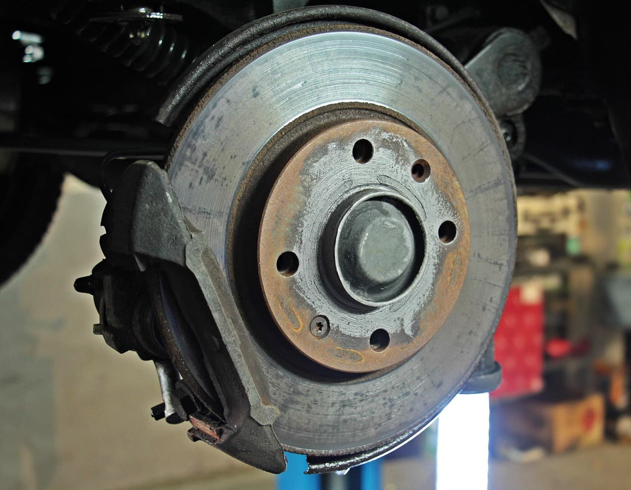 Brake disc on a car raised on a lift