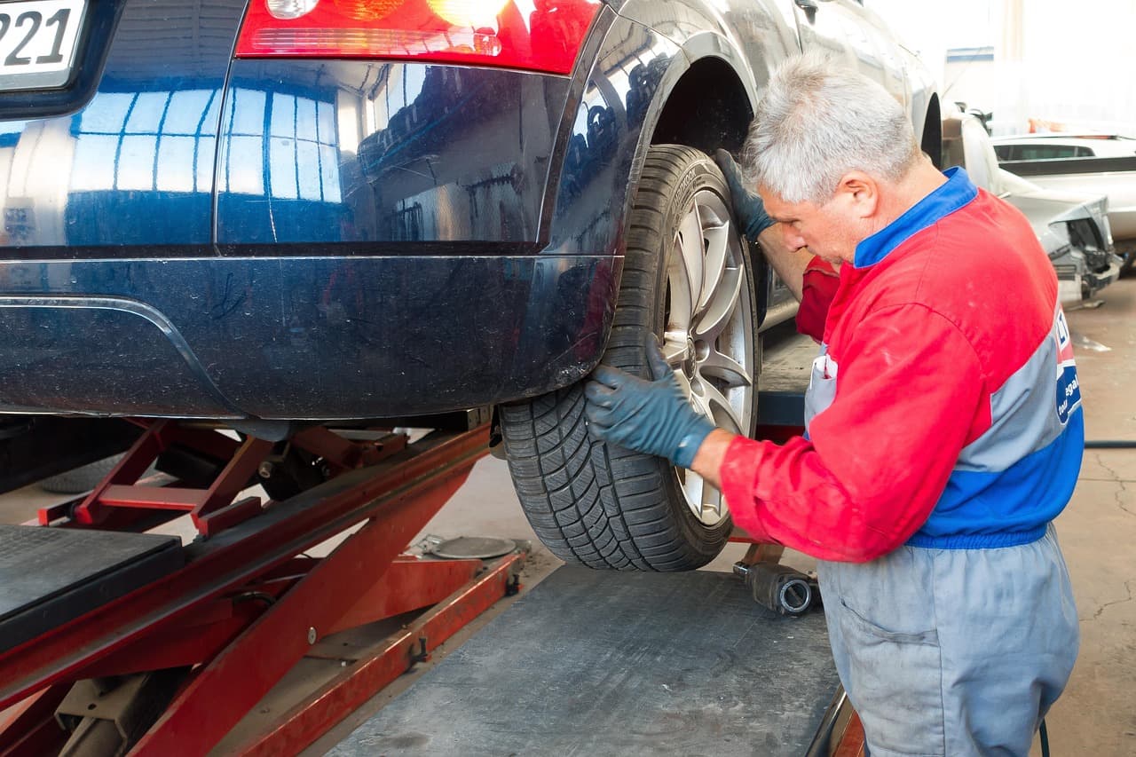 Mechanic fitting a wheel